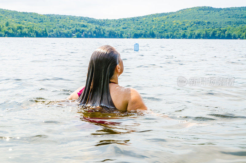 Woman getting out of water